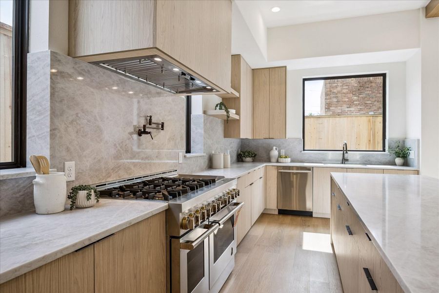 Six burner gas range offers double oven, a griddle and a pot filler. Six burner gas range offers double oven, a griddle and a pot filler.