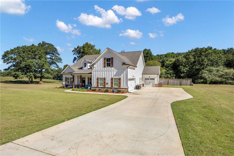Front exterior of a new home in , Monroe, GA, highlighting curb appeal (Image 24). Front exterior of a new home in , Monroe, GA, highlighting curb appeal (Image 24).