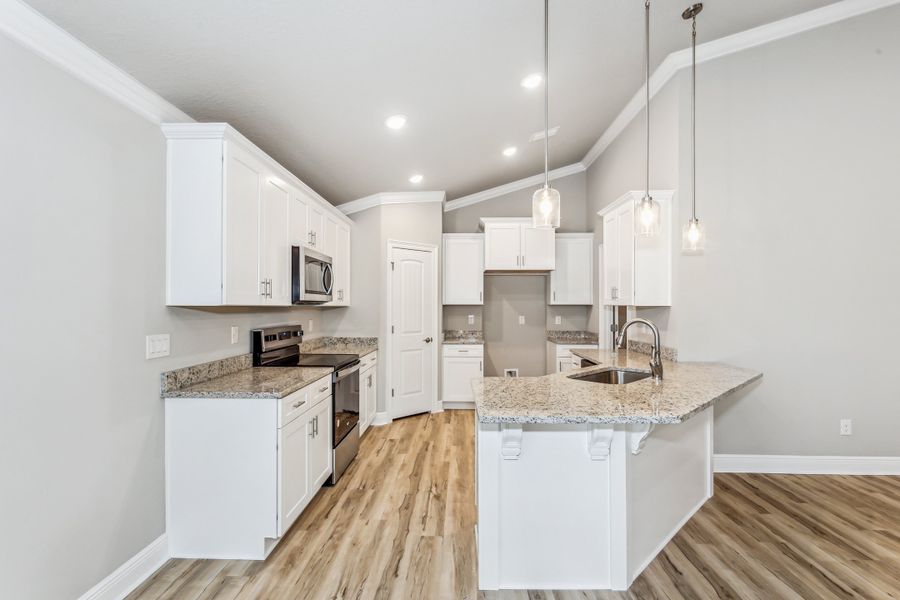 Representative furnished interior of a home built from the The Carlos by Herbst Homes in Doyle Hawkins Landing, Navarre (Image 62).