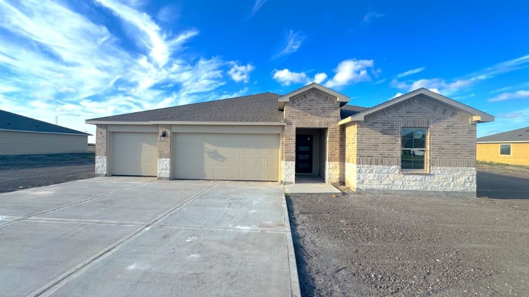 Front exterior of a new home in The Reserve at London, Corpus Christi, TX, highlighting curb appeal (Image 1). Front exterior of a new home in The Reserve at London, Corpus Christi, TX, highlighting curb appeal (Image 1).