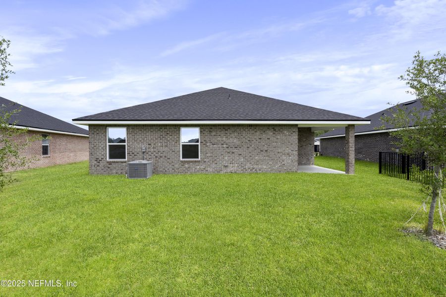 Exterior details and patio area of a home in Shadow Crest at Rolling Hills, Green Cove Springs (Image 4). Exterior details and patio area of a home in Shadow Crest at Rolling Hills, Green Cove Springs (Image 4).