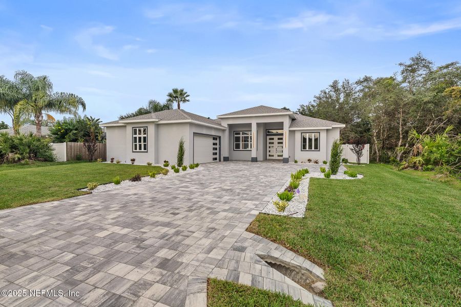 Front exterior of a new home in , Palm Coast, FL, highlighting curb appeal (Image 37). Front exterior of a new home in , Palm Coast, FL, highlighting curb appeal (Image 37).