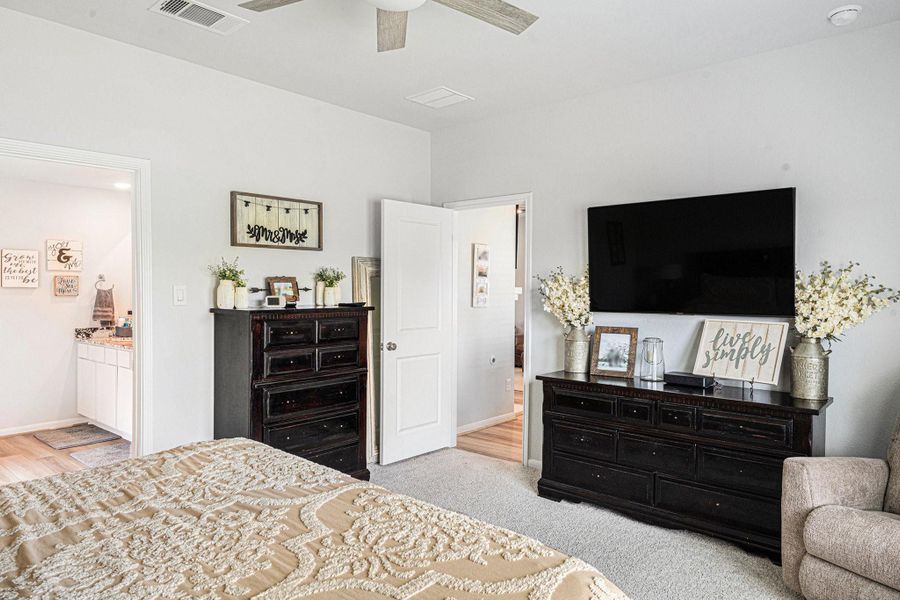 Another view of the primary bedroom looking back toward the living area and entrance to the primary bath. Another view of the primary bedroom looking back toward the living area and entrance to the primary bath.