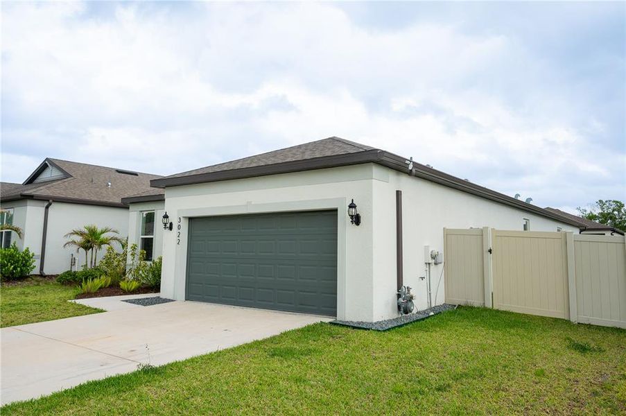 Front exterior of a new home in Marwood, Ellenton, FL, highlighting curb appeal (Image 24).