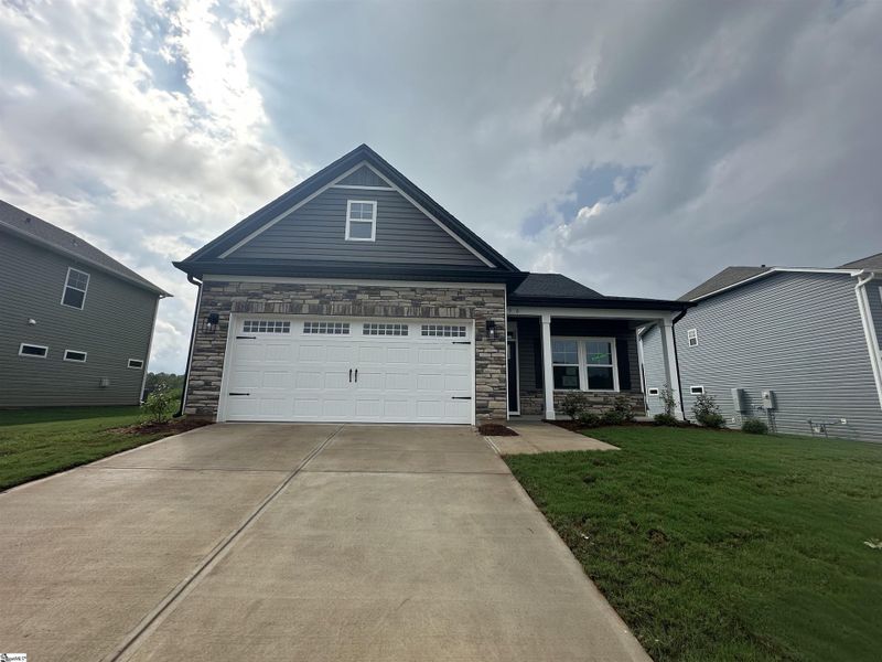 Front exterior of a new home in Shiloh Trail, Wellford, SC, highlighting curb appeal (Image 22). Front exterior of a new home in Shiloh Trail, Wellford, SC, highlighting curb appeal (Image 22).