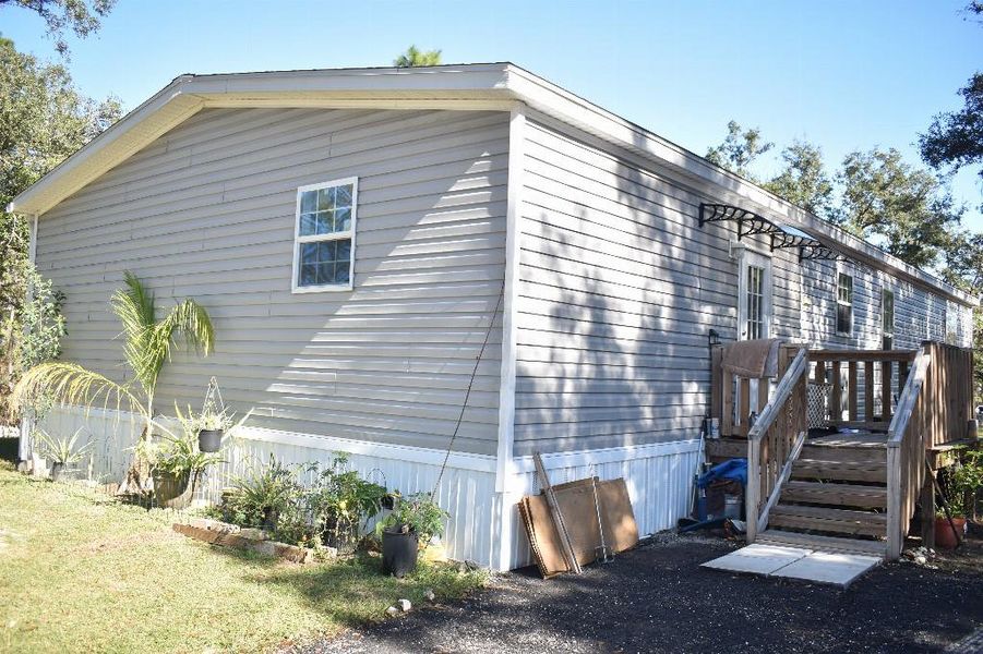 Exterior details and patio area of a home in , Williston (Image 25).