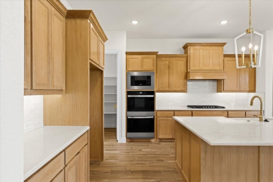 Representative furnished interior of a home built from the The Braden II by Doug Parr Custom Homes in Kessler Farms, Brock (Image 12).