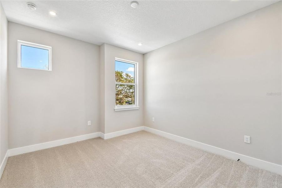 Spacious, unfurnished interior of a new home in EvenTide, New Smyrna Beach (Image 14).