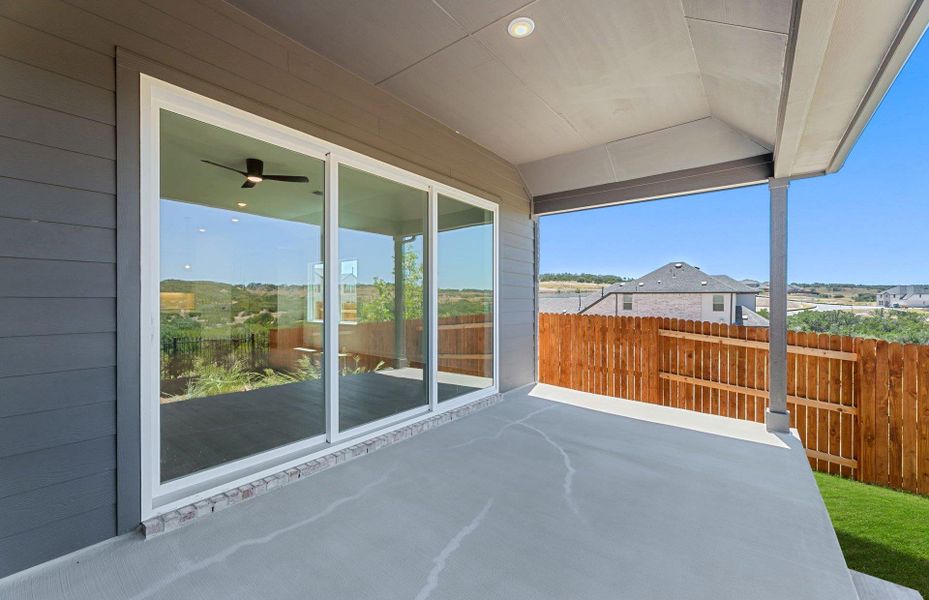 Exterior details and patio area of a home in West Cypress Hills, Spicewood (Image 22).