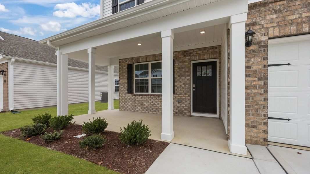 Exterior details and patio area of a home in Ridgewood Farms, Winterville (Image 3).