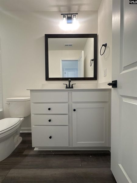 Furnished interior view inside a new home in Piney Woods Bluff, Columbia (Image 1).