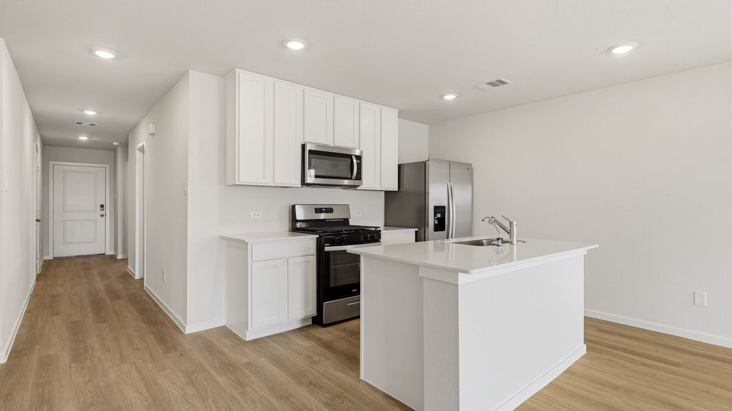 Furnished interior view inside a new home in Sunterra, Katy (Image 7).