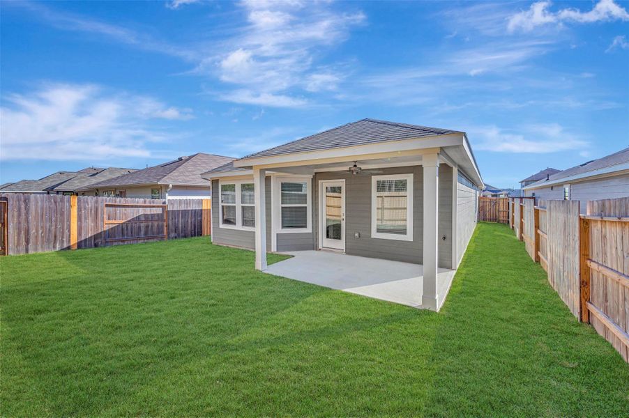 Exterior details and patio area of a home in Pinewood at Grand Texas, New Caney (Image 27).