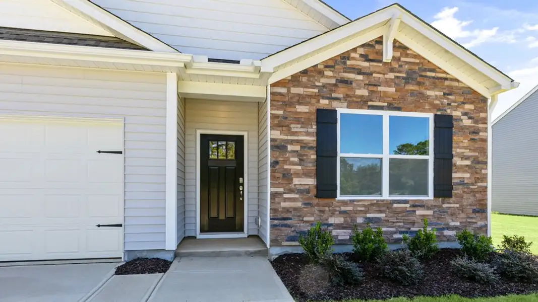 Exterior details and patio area of a home in The Landing at Winston Pointe, Clayton (Image 3). Exterior details and patio area of a home in The Landing at Winston Pointe, Clayton (Image 3).