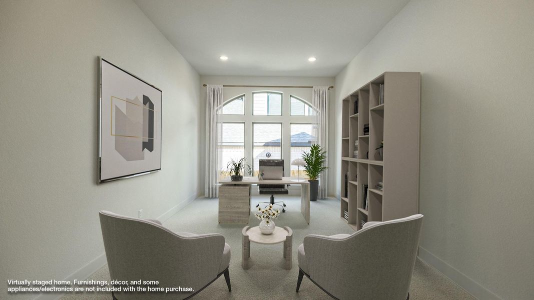 Office area with light colored carpet and recessed lighting