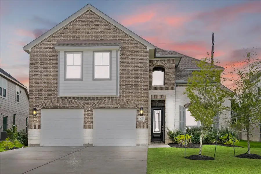 Front exterior of a new home in Grand Oaks – The Cove, Houston, TX, highlighting curb appeal (Image 2).