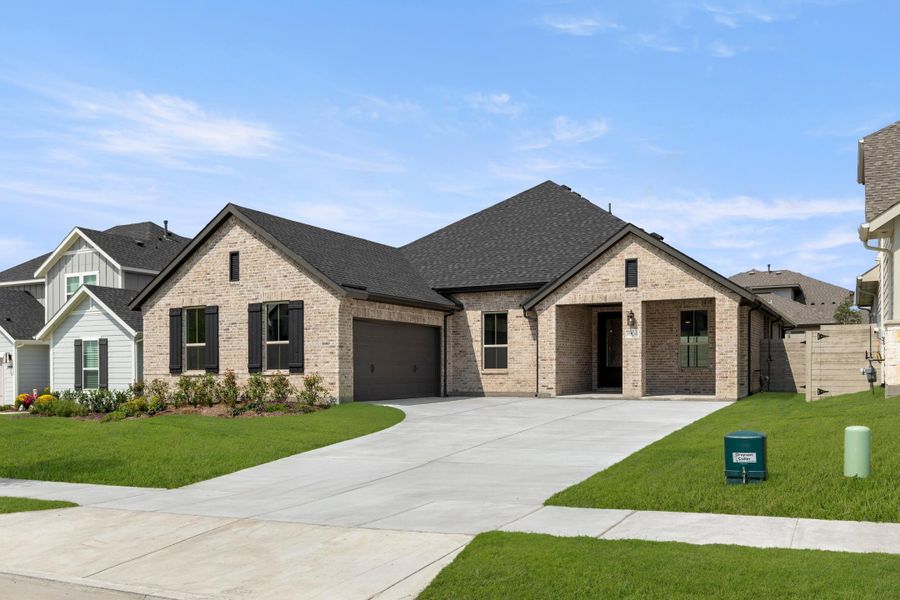 Front exterior of a new home in Inspiration Collection 60 at Painted Tree, McKinney, TX, highlighting curb appeal (Image 2). Front exterior of a new home in Inspiration Collection 60 at Painted Tree, McKinney, TX, highlighting curb appeal (Image 2).