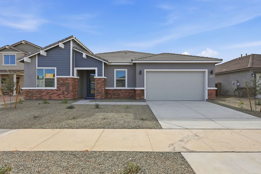 Front exterior of a new home in Miravida, Surprise, AZ, highlighting curb appeal (Image 1). Front exterior of a new home in Miravida, Surprise, AZ, highlighting curb appeal (Image 1).
