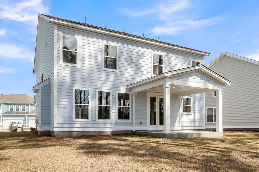 Exterior details and patio area of a home in Tidewater at Lakes of Cane Bay, Summerville (Image 4).