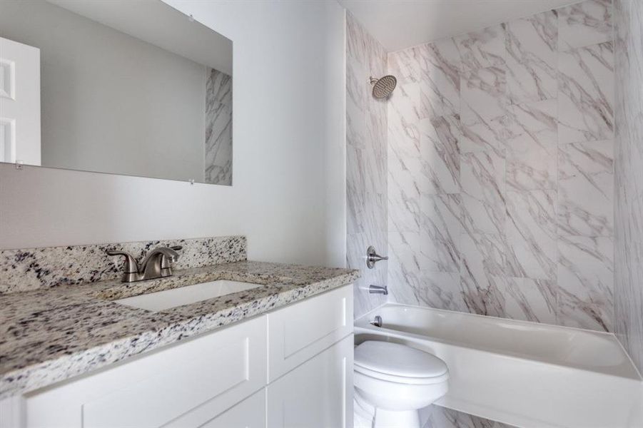 Full bathroom with vanity and bathtub / shower combination