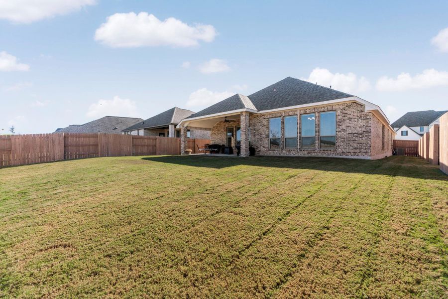 Exterior details and patio area of a home in The Colony, Bastrop (Image 3).