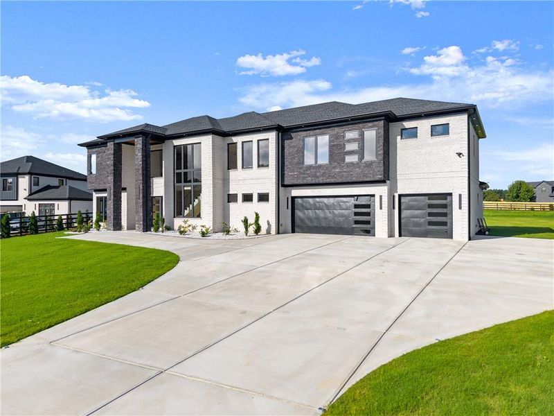 Front exterior of a new home in , Dacula, GA, highlighting curb appeal (Image 26).