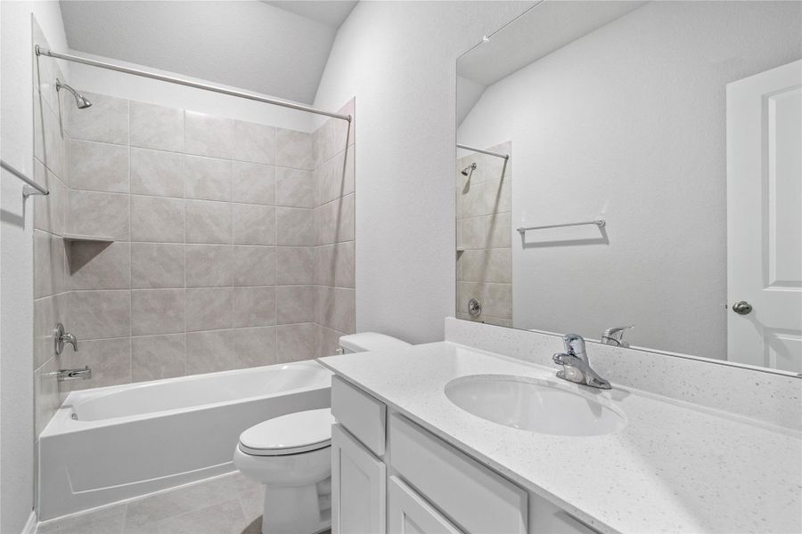 A streamlined secondary bathroom providing a functional tub/shower combination and modern fixtures, seamlessly blending practicality and style.