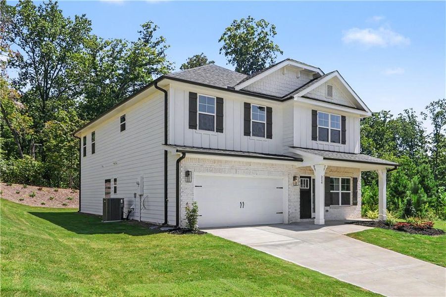 Front exterior of a new home in Thunder Ridge, Dawsonville, GA, highlighting curb appeal (Image 1). Front exterior of a new home in Thunder Ridge, Dawsonville, GA, highlighting curb appeal (Image 1).
