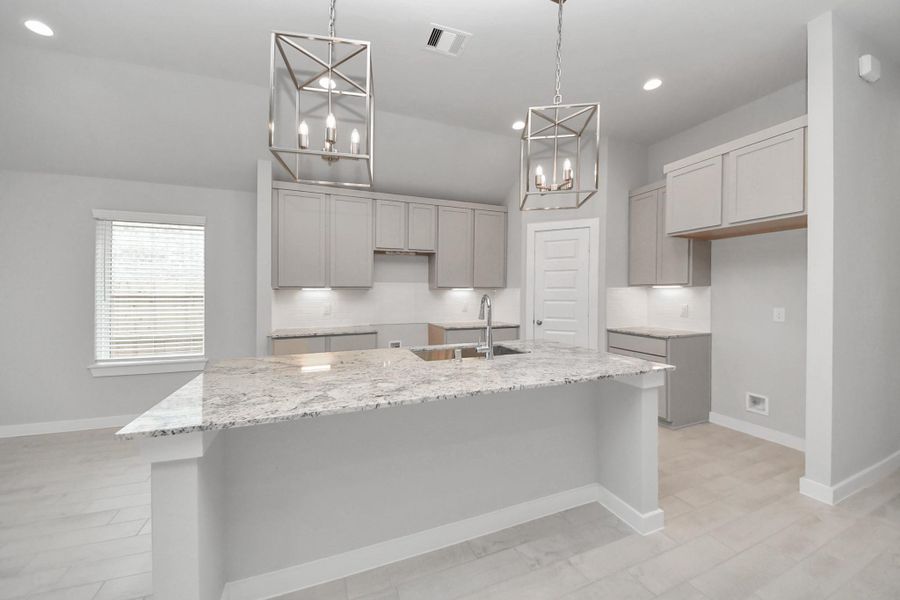 The extended counter area adds both practicality and style, making meal preparation a breeze. Every detail is thoughtfully designed to enhance the kitchen's functionality and aesthetic appeal.