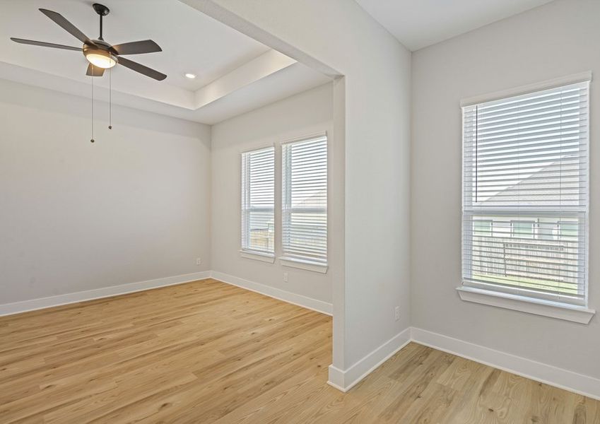 The master bedroom has three large windows that let in great, natural light.
