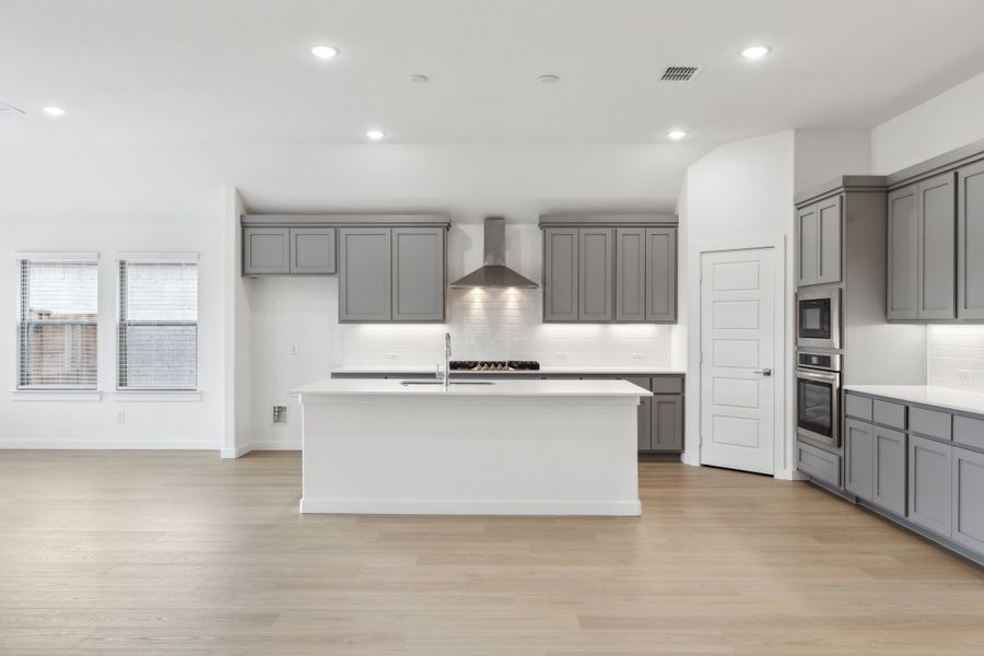 Kitchen in the Gilmour II home plan by Trophy Signature Homes – REPRESENTATIVE PHOTO