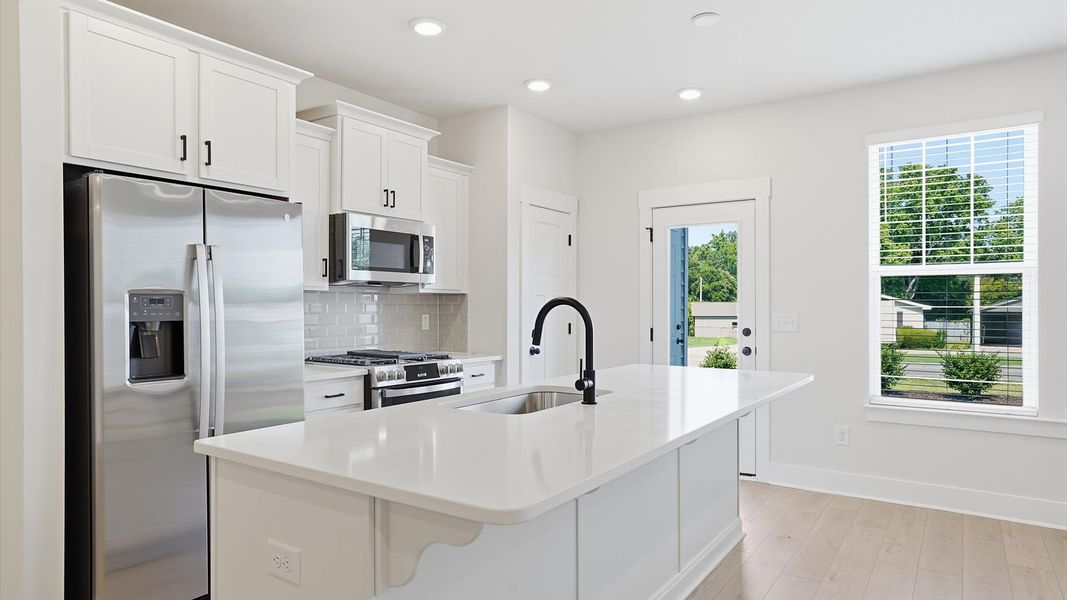 Elegant island anchors this tasteful kitchen with high standards and timeless appeal located at Saluda Crossing Elegant island anchors this tasteful kitchen with high standards and timeless appeal located at Saluda Crossing