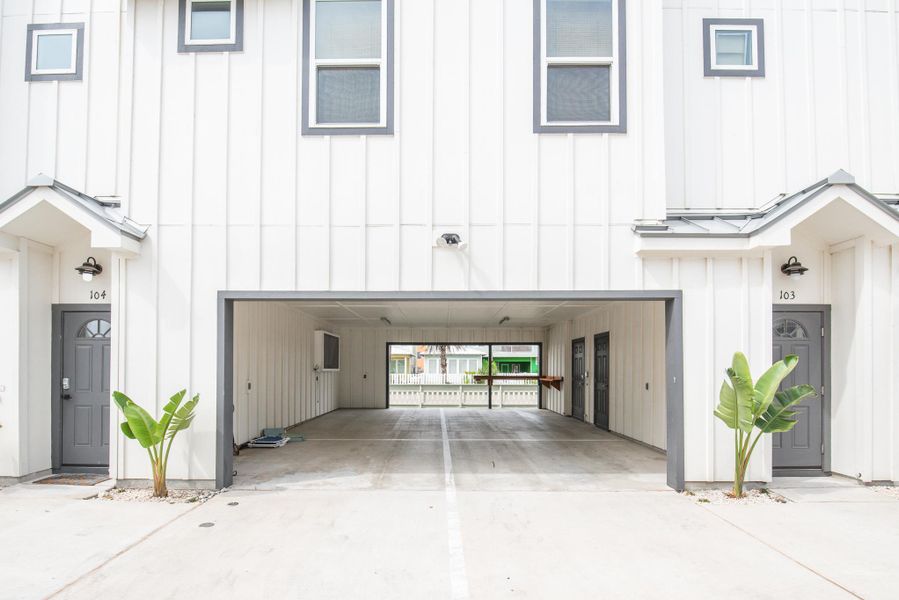 Modern farmhouse style home featuring board and batten siding, a garage, and driveway Modern farmhouse style home featuring board and batten siding, a garage, and driveway