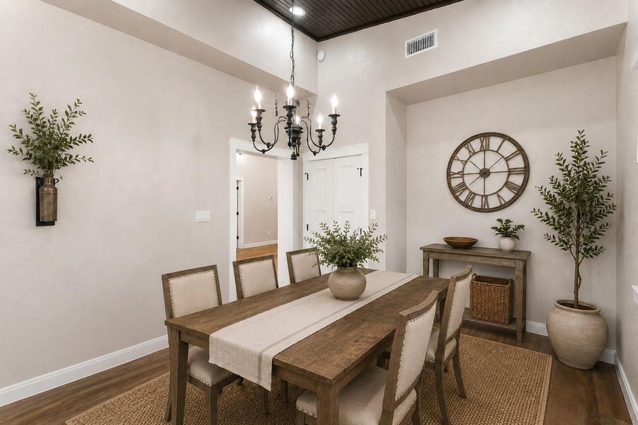 This room can be used as dining or a bonus room with the elegant tile flooring and soft taupe walls, accented by a classic chandelier. The space is finished with white trim and double doors, creating a welcoming entryway. This room can be used as dining or a bonus room with the elegant tile flooring and soft taupe walls, accented by a classic chandelier. The space is finished with white trim and double doors, creating a welcoming entryway.