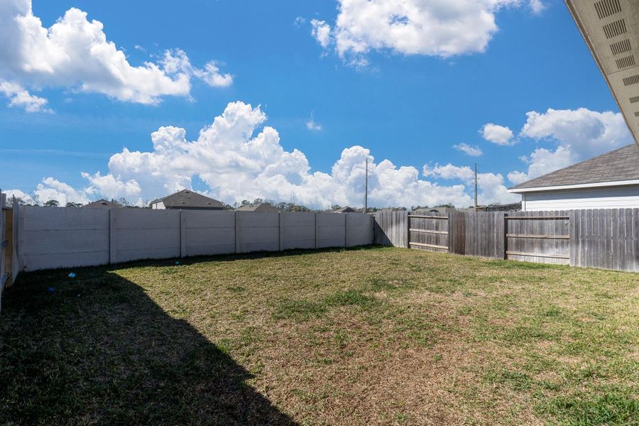 Exterior details and patio area of a home in Tavola: Cottage Collection, New Caney (Image 2). Exterior details and patio area of a home in Tavola: Cottage Collection, New Caney (Image 2).