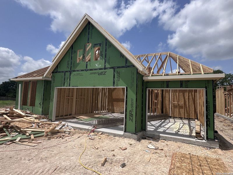 In-progress construction of a new home in Village at Three Oaks, Seguin, TX (Image 19).