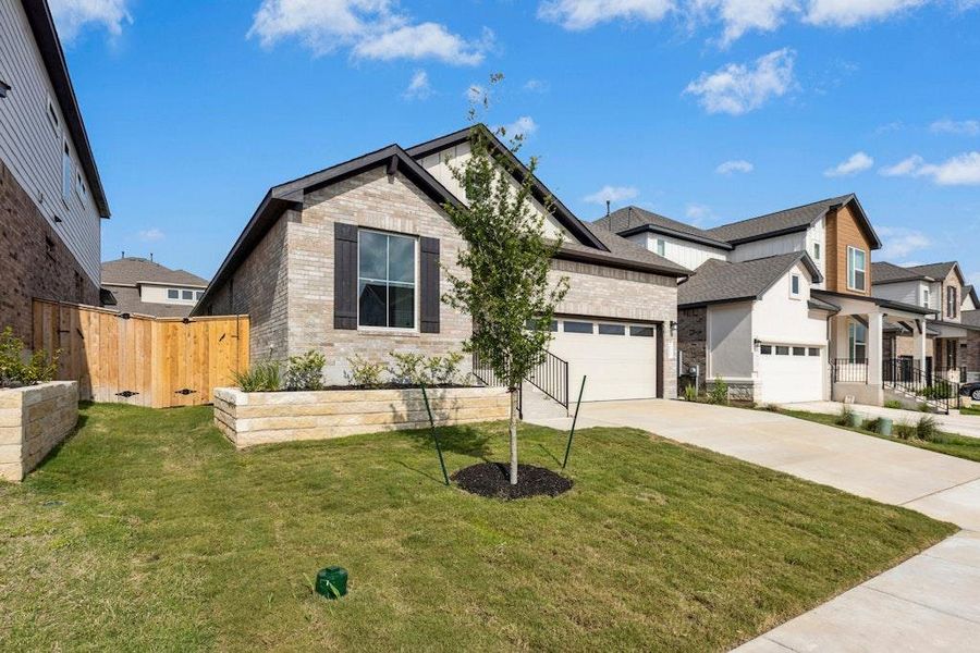 Front exterior of a new home in University Heights, Round Rock, TX, highlighting curb appeal (Image 16). Front exterior of a new home in University Heights, Round Rock, TX, highlighting curb appeal (Image 16).