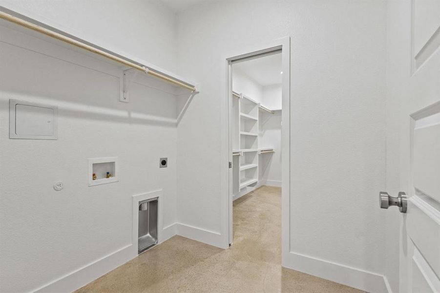 Laundry room with hookup for a washing machine, electric dryer hookup, and concrete flooring