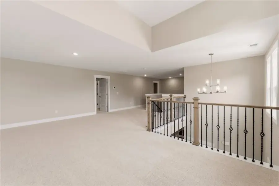 A spacious upper-level bonus room features plush c A spacious upper-level bonus room features plush c