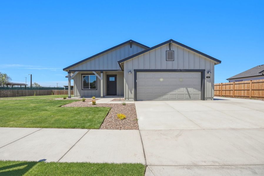 Front exterior of a new home in Willowbrook, Madras, OR, highlighting curb appeal (Image 24).