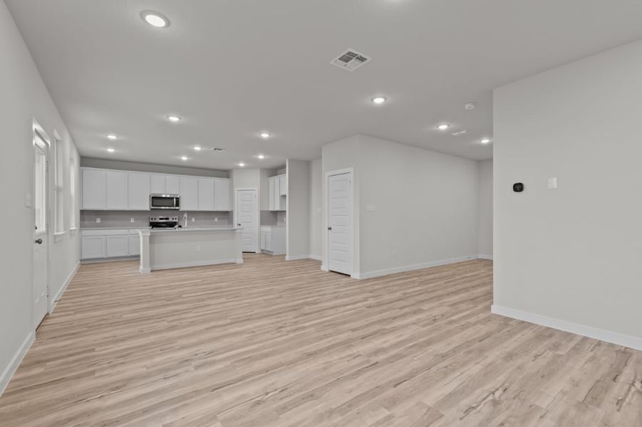 A large empty kitchen. A large empty kitchen.