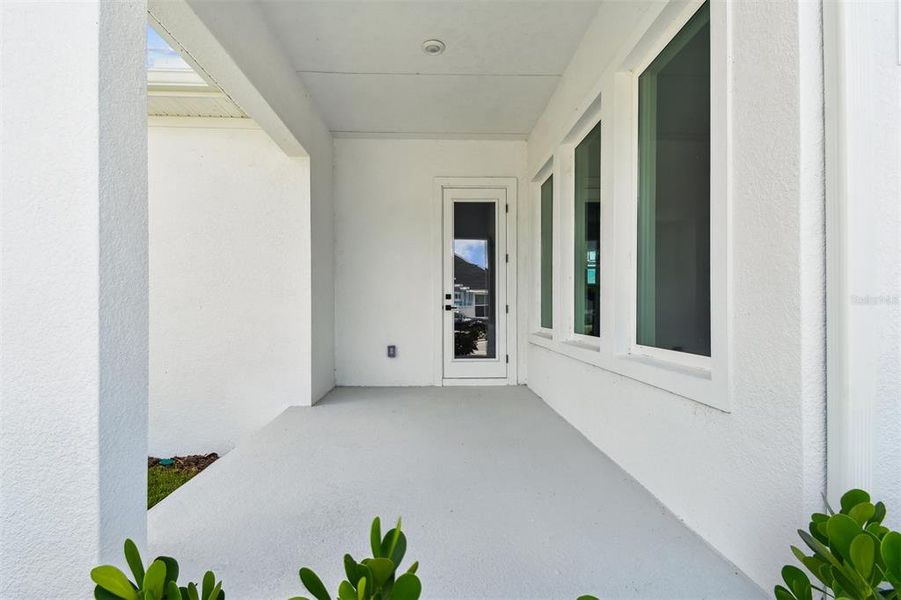 Exterior details and patio area of a home in Emerald Landing at Waterside at Lakewood Ranch – Cottage Series, Sarasota (Image 18).