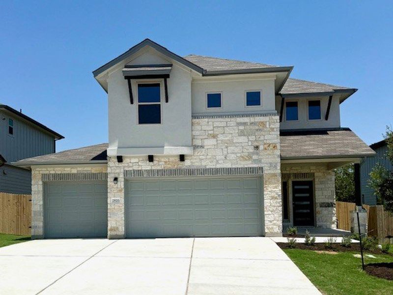 Front exterior of a new home in The Hills of Bear Creek, Manchaca, TX, highlighting curb appeal (Image 3).