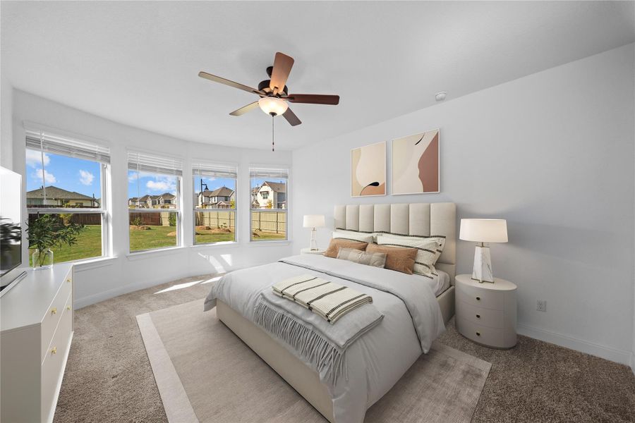 Carpeted bedroom with ceiling fan and a residential view Carpeted bedroom with ceiling fan and a residential view