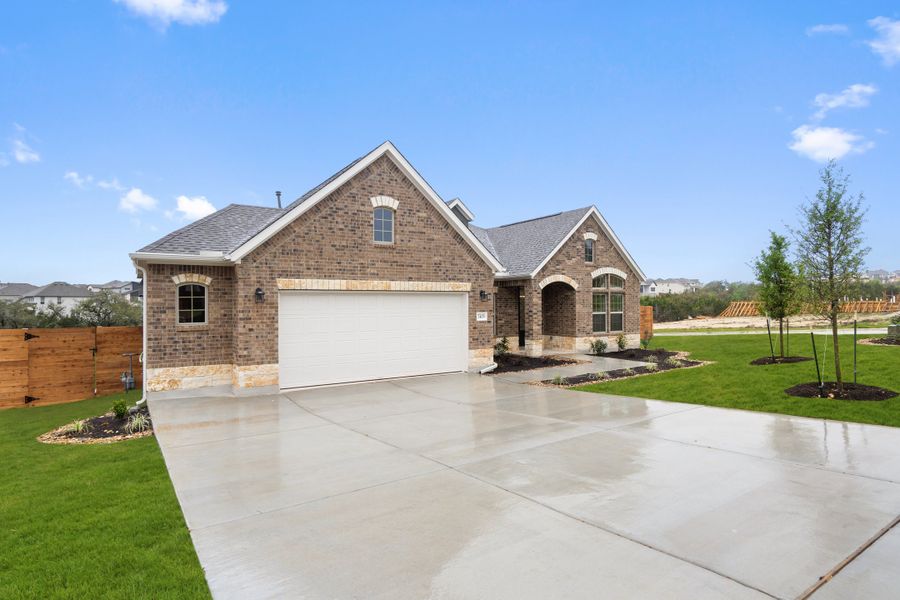 Representative exterior photo of a completed home built from the Palmer by Ashton Woods in The Estates at La Cima, San Marcos, TX (Image 2).
