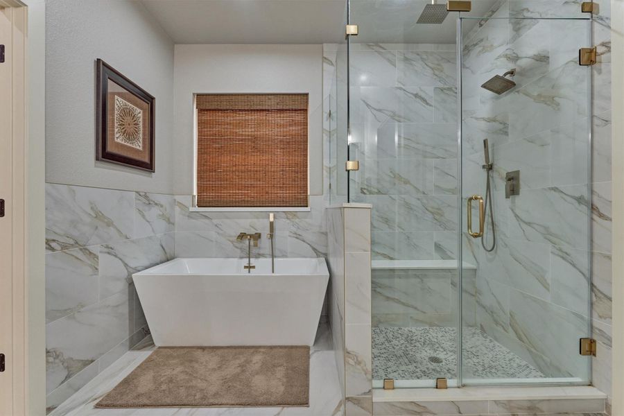 Note the shower bench, upgraded fixtures and wall tile. Note the shower bench, upgraded fixtures and wall tile.