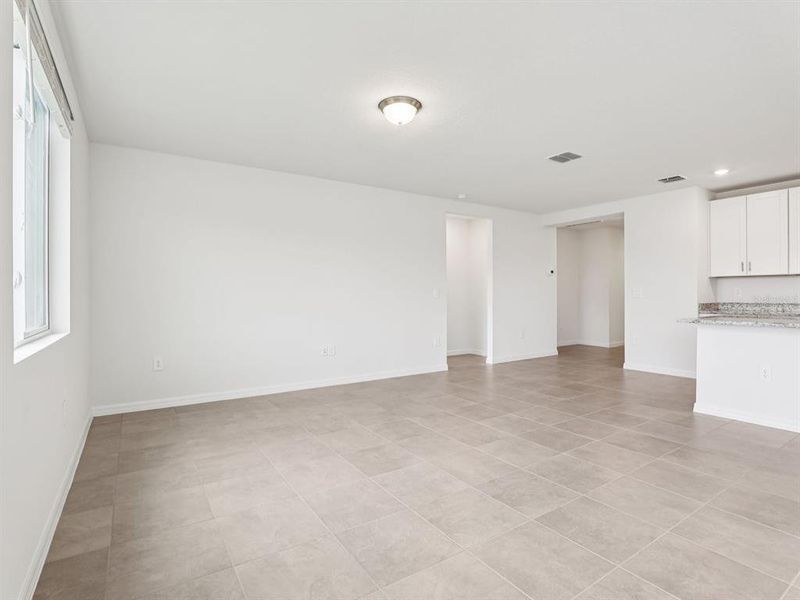 Spacious, unfurnished interior of a new home in The Grove at Stuart Crossing - Classic Series, Bartow (Image 6).