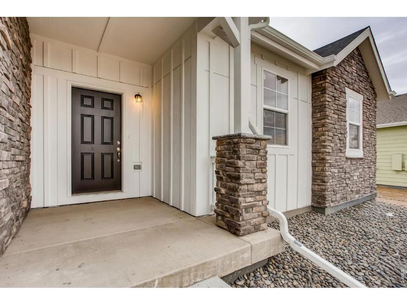 Exterior details and patio area of a home in Farmstead, Berthoud (Image 3).
