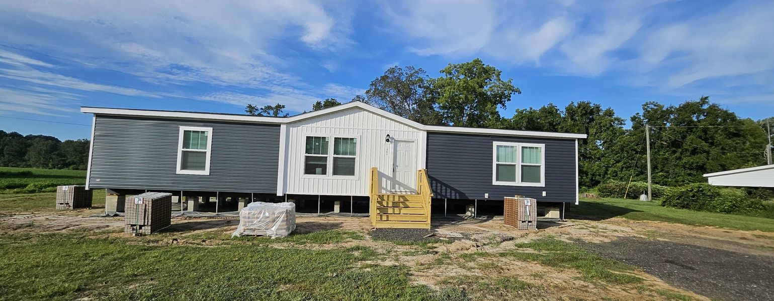 Front exterior of a new home in , Harleyville, SC, highlighting curb appeal (Image 11).