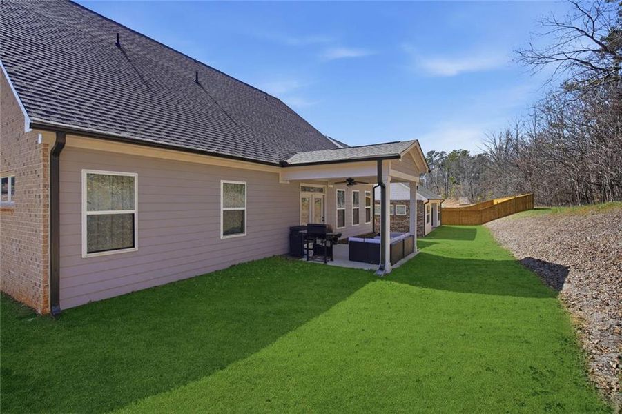 Exterior details and patio area of a home in Cambridge, Flowery Branch (Image 27).